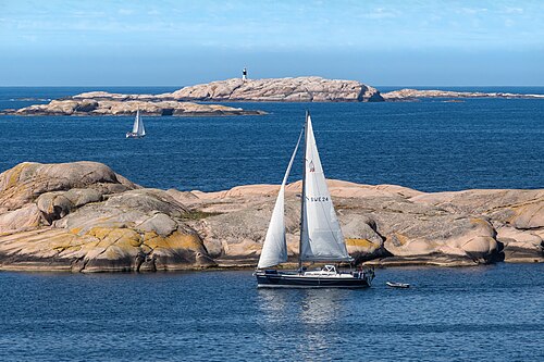 Sailboats between the red granite cliffs in Stångehuvud nature reserve, Lysekil, Sweden.
